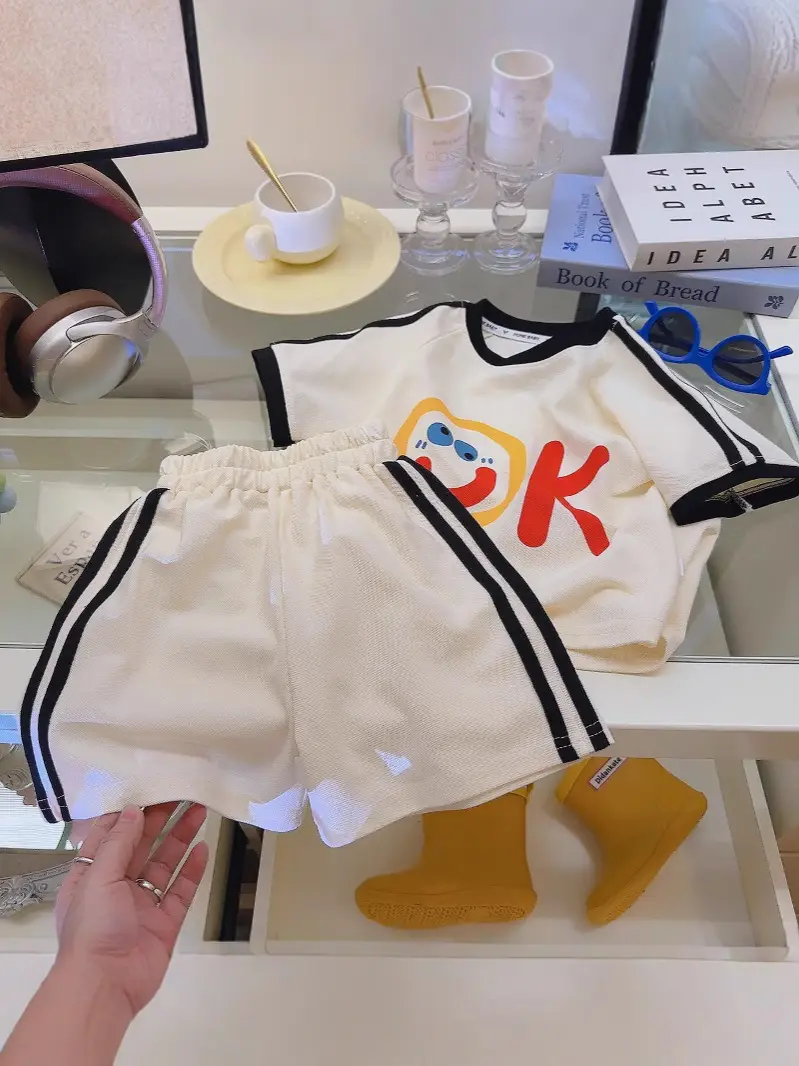 Off-White Short-Sleeve Kids Suit with Smile Graphic - Image 5