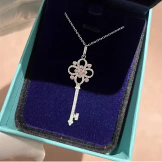 Women's Diamond Key Pendant Necklace with Four-Leaf Clover Design